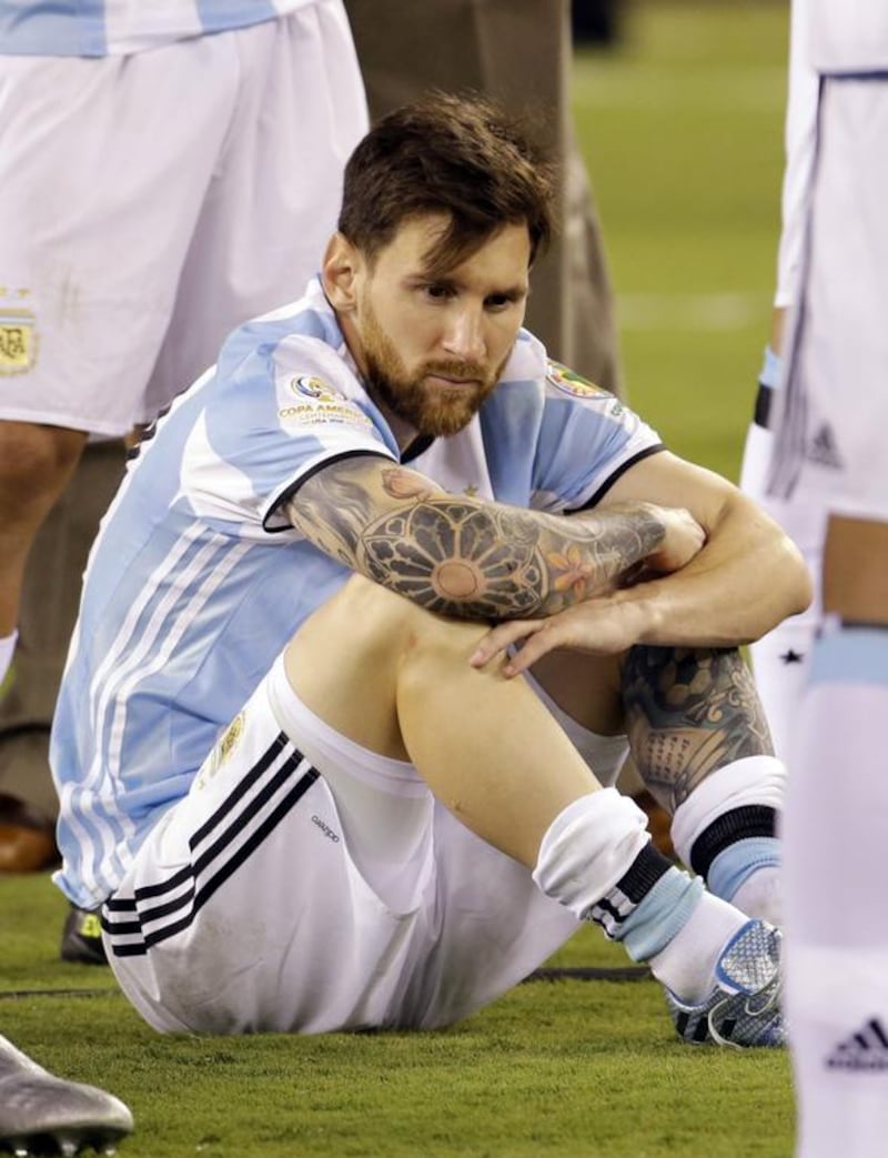 Argentina's Lionel Messi waits for trophy presentations after the Copa America Centenario championship match. Julio Cortez / AP Photo