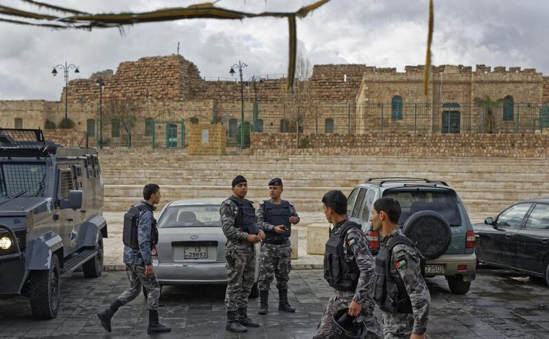 Jordanian security forces stand guard outside Karak castle. Ben Curtis / AP Photo