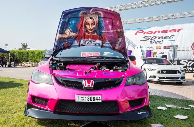 ABU DHABI, UNITED ARAB EMIRATES, 28 OCTOBER 2018 -A Honda Civic with Harley Quinn design owned by Richard at the Street Meet modified cars event, Abu Dhabi City Golf Club.  Leslie Pableo for The National for Adam Workman's story