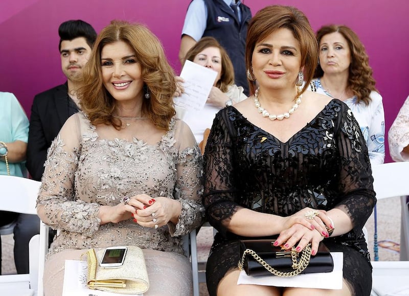 Egyptian actresses Mervet Ameen, left, and Elham Shahine, right, attend a fashion show by Emirati fashion designer Mona al-Mansouri during the Summer Fashion Week in the Lebanese capital, Beirut. Anwar Amro / AFP photo