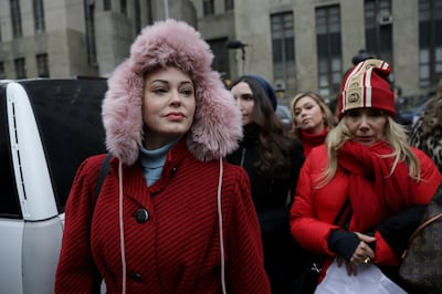 FILE PHOTO: Rose McGowan arrives with Rosanna Arquette to speak to reporters outside New York Criminal Court on the first day of film producer Harvey Weinstein's sexual assault trial in the Manhattan borough of New York City, New York, U.S., January 6, 2020. REUTERS/Jeenah Moon/File Photo