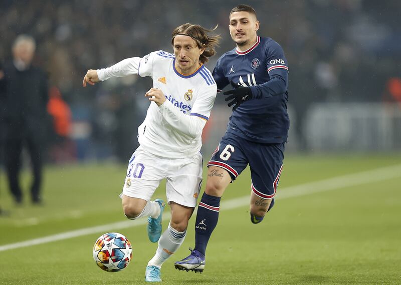 Real Madrid's Luka Modric outpaces PSG’s Marco Verratti. EPA