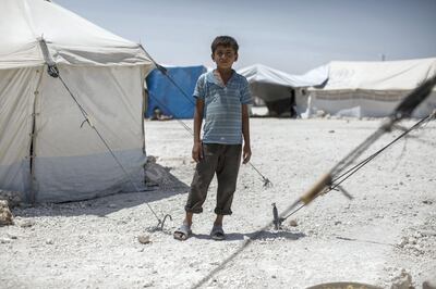 Yacoub*, 12, from Raqqa, Syria, stands outside the tent in which he and his family now live, in a camp for people displaced by the war against ISIS, in , Syria. Picture taken on August 2, 2017.
Yacoub left Raqqa with his parents and nine siblings three months ago; as they fled the city ISIS fighters fired at their car. They arrived in the camp two months ago.  
Yacoub was unable to go to school after ISIS occupied Raqqa as parents feared the schools might be hit in an airstrike. He told Save The Children of atrocities he'd witnessed under ISIS: "The people from ISIS used to cut people’s heads off. They would catch them and cut off their heads and sometimes they would beat them with rifles"."In the Naeem roundabout they filled the roundabout - with heads that had been cut off. They filled the whole roundabout."."[We saw] them cutting off of the heads 
 everything.
 we saw them doing it, and cutting off hands." Photo by Sam Tarling