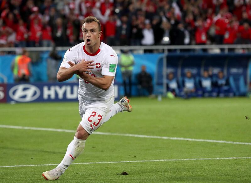 epa06832010 Xherdan Shaqiri of Switzerland celebrates scoring the 2-1 lead during the FIFA World Cup 2018 group E preliminary round soccer match between Serbia and Switzerland in Kaliningrad, Russia, 22 June 2018.

(RESTRICTIONS APPLY: Editorial Use Only, not used in association with any commercial entity - Images must not be used in any form of alert service or push service of any kind including via mobile alert services, downloads to mobile devices or MMS messaging - Images must appear as still images and must not emulate match action video footage - No alteration is made to, and no text or image is superimposed over, any published image which: (a) intentionally obscures or removes a sponsor identification image; or (b) adds or overlays the commercial identification of any third party which is not officially associated with the FIFA World Cup)  EPA/MARTIN DIVISEK   EDITORIAL USE ONLY