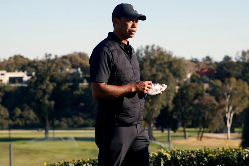 Tiger Woods looks on during the trophy ceremony on the practice green after the final round of the Genesis Invitational golf tournament at Riviera Country Club, Sunday, Feb. 21, 2021, in the Pacific Palisades area of Los Angeles. (AP Photo/Ryan Kang)