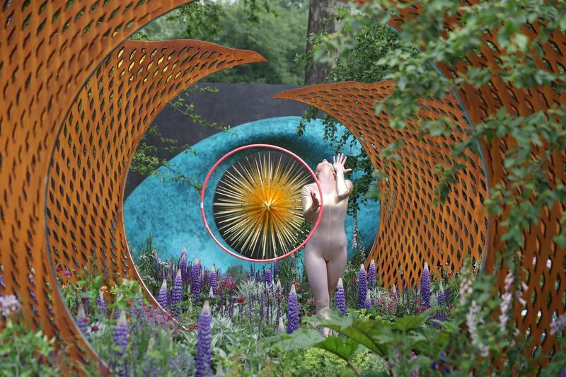 A dancer performs in The David Harber and Savills Garden at the 2018 Chelsea Flower Show in London. All photos by Daniel Leal-Olivas / AFP Photo