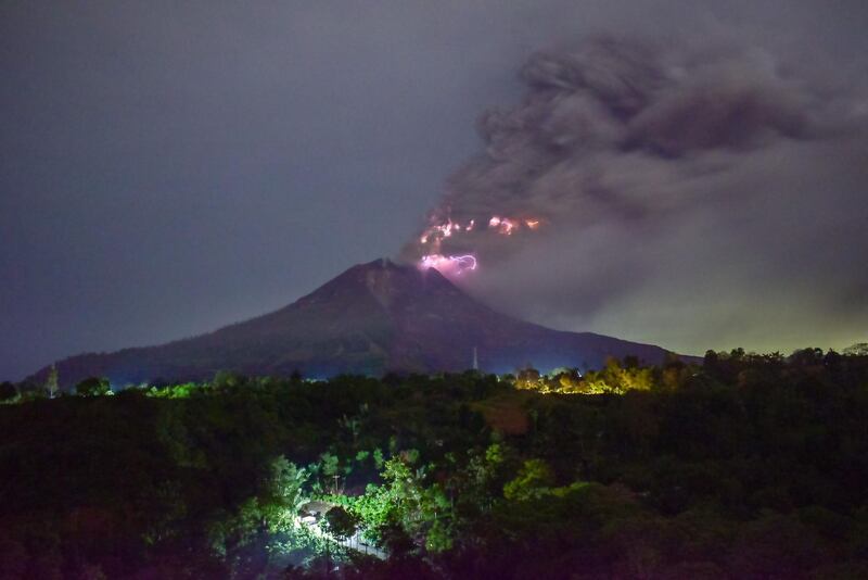 Mount Sinabung spews volcanic ash during its eruption as seen from Karo, in North Sumatra.  AFP