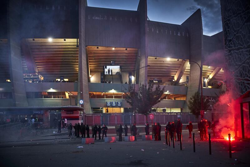 French riot police stand in clouds of tear gas outside the Parc des Princes. Getty