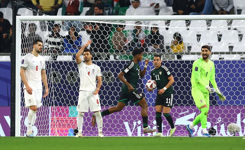 The UAE's Yahya Al Ghassani celebrates after scoring their first goal with teammate Caio Canedo. Reuters