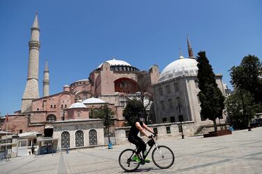 A cyclist rides past the Hagia Sophia museum in Istanbul. Reuters