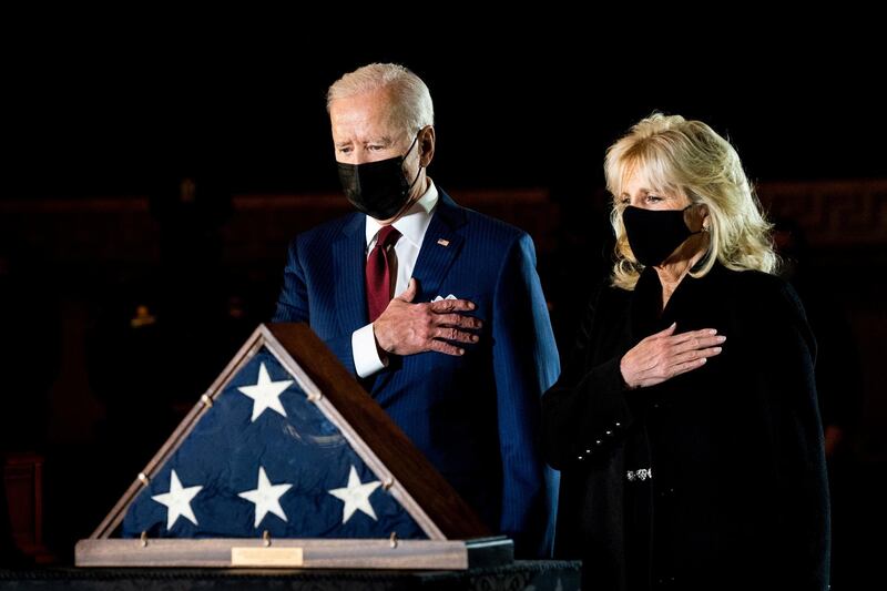 President Joe Biden and first lady Jill Biden pay their respects to police officer Brian Sicknick, who died on January 7 from injuries he sustained protecting the US Capitol during the January 6 mob attack, as he lies in honour in the Rotunda of the US Capitol, in Washington. Reuters