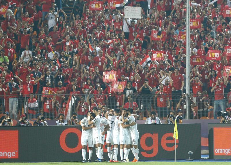 Egyptian players celebrate after a goal during the African Cup of Nations group A soccer match between Egypt and Uganda in Cairo International Stadium in Cairo, Egypt. AP Photo