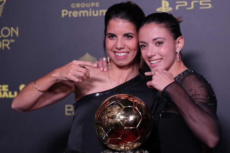 Spain and Barcelona midfielder Bonmati, right, poses with her Ballon d'Or award. AFP