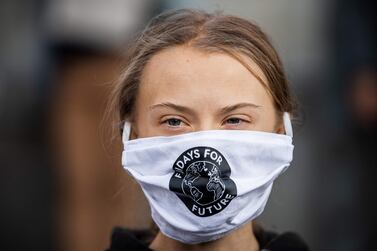 Swedish climate activist Greta Thunberg (C) takes part in a Fridays For Future protest in front of the Swedish Parliament (Riksdagen) in Stockholm on September 25, 2020. Fridays for Future school strike movement called for a global day of climate action on September 25, 2020 AFP