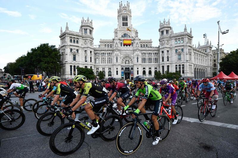 The peloton rides past the Madrid city hall during the final stage of the Vuelta a Espana on Sunday.  AFP