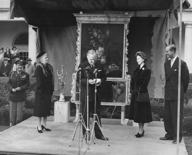 Princess Elizabeth and Prince Philip smiling as former US president Harry Truman gives a speech in Washington, in November 1951. Getty Images