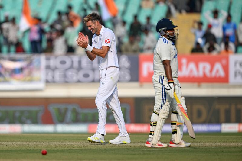 England's James Anderson celebrate after the run-out of Sarfaraz Khan. AFP