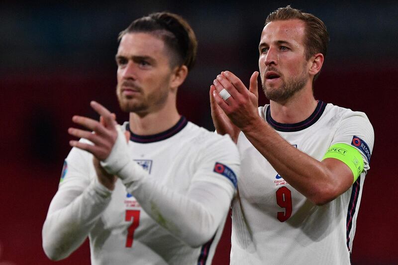 Forward Harry Kane and midfielder Jack Grealish applaud after the match. AFP