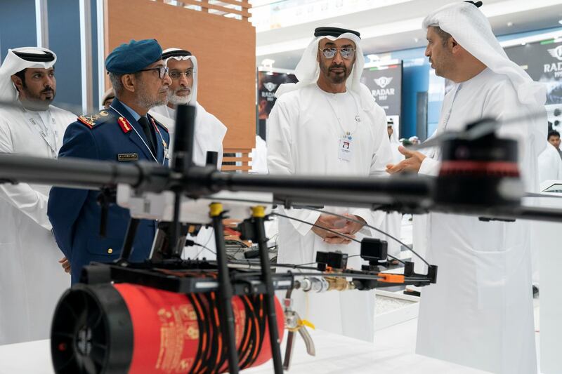 ABU DHABI, UNITED ARAB EMIRATES - February 20, 2019: HH Sheikh Mohamed bin Zayed Al Nahyan, Crown Prince of Abu Dhabi and Deputy Supreme Commander of the UAE Armed Forces (2nd R) visits Khalifa University stand, during the 2019 International Defence Exhibition and Conference (IDEX), at Abu Dhabi National Exhibition Centre (ADNEC). Seen with HE Major General Essa Saif Al Mazrouei, Deputy Chief of Staff of the UAE Armed Forces (2nd L) and HE Major General (Ret) Khaled Abdullah Al Bu Ainain, President of the Institute for Near East and Gulf Military Analysis (INEGMA) (3rd L).
( Ryan Carter for the Ministry of Presidential Affairs )
---