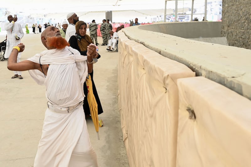 Pilgrims perform the symbolic stoning of the devil ritual in Mina, near Makkah. AFP