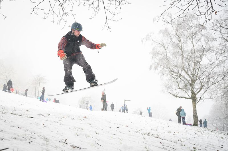 A man snowboards down the hill near Alexandra Palace in London, United Kingdom. Parts of the country saw snow and icy conditions as arctic air caused temperatures to drop. Getty Images