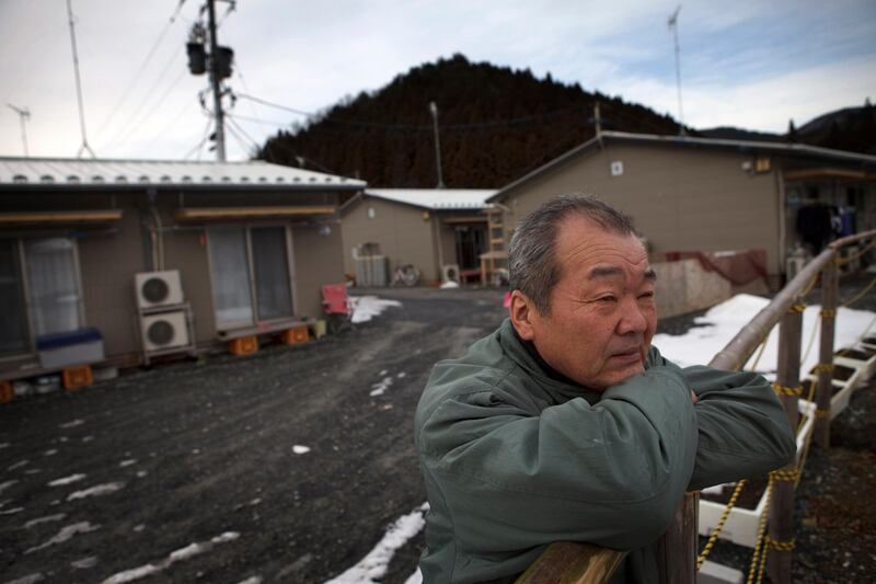 Yoshihiro Takahashi, 65, stands outside his temporary house in Onagawa in Miyagi prefecture, Japan on Feb 5, 2012. Takahashi lost his wife, Hisako, and mother Satoko as well as his house by the massive tsunami hit the northern Japan on March 11, 2011.
Photo by Kuni Takahashi