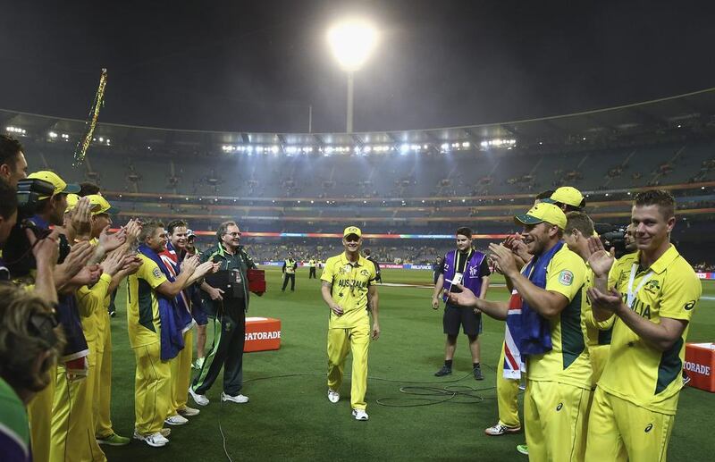 Players form a guard of honour for Michael Clarke as he leaves the field after Australia’s bowling innings. Ryan Pierse / Getty Images
