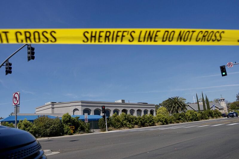 TOPSHOT - Sheriff's crime scene tape is placed in front of the Chabad of Poway Synagogue after a shooting on Saturday, April 27, 2019 in Poway, California. A gunman opened fire at a synagogue in California, killing one person and injuring three others including the rabbi as worshippers marked the final day of Passover, officials said Saturday, April 27, 2019. The shooting in the town of Poway came exactly six months after a white supremacist shot dead 11 people at Pittsburgh's Tree of Life synagogue -- the deadliest attack on the Jewish community in the history of the United States.  AFP