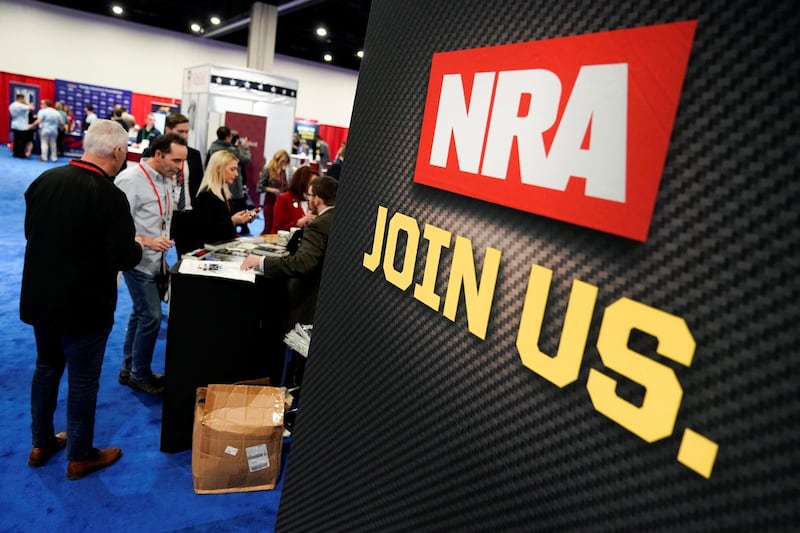 Attendees sign up at the National Rifle Association (NRA) booth at the Conservative Political Action Conference (CPAC) annual meeting at National Harbor in Oxon Hill, Maryland, U.S., February 27, 2020.      REUTERS/Joshua Roberts