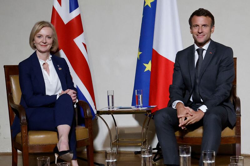 French President Emmanuel Macron and Britain's Prime Minister Liz Truss meet during the European Political Community Summit in Prague, the Czech Republic, on Thursday. AFP