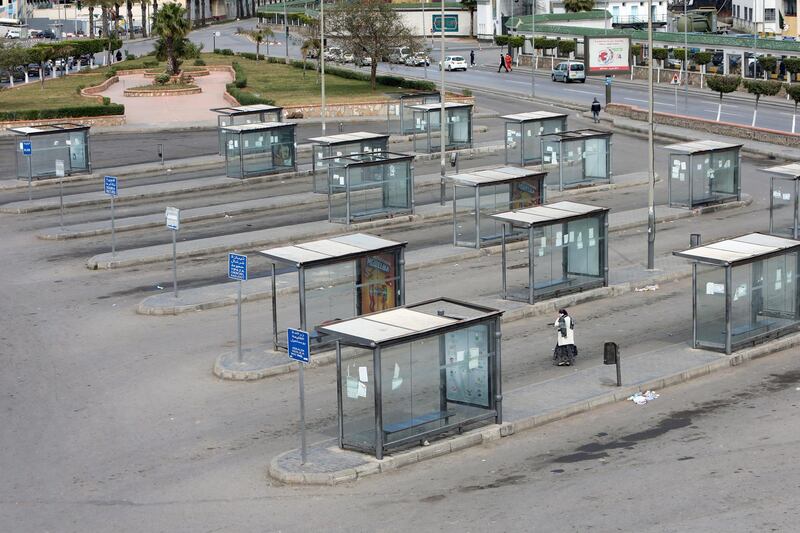 A woman walks at an empty platform of a bus station, following the spread of the coronavirus disease (COVID-19), in Algiers, Algeria March 22, 2020. REUTERS/Ramzi Boudina