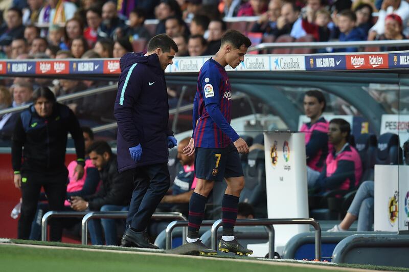 Philippe Coutinho of FC Barcelona leaves the pitch injured. Getty Images