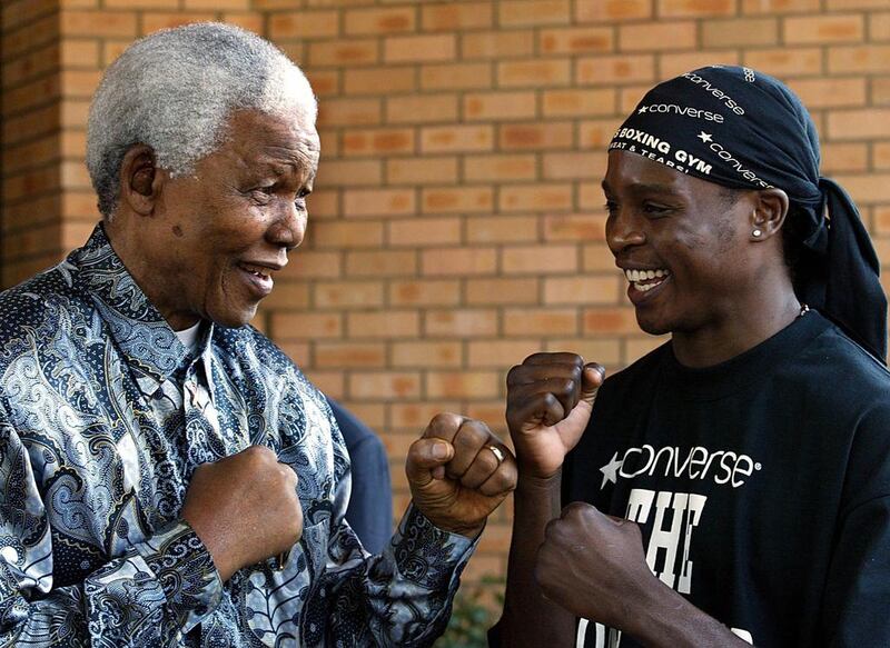 Mandela and boxer Philip Ndouin 2003. AFP