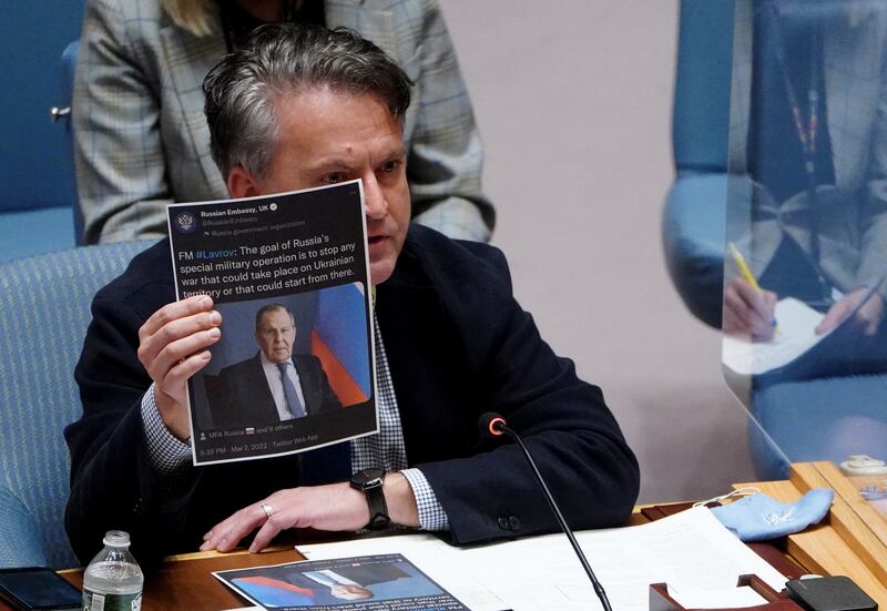 Ukraine's UN ambassador Sergey Kyslytsya holds a paper with an image of Russia's Foreign Minister Sergey Lavrov as he addresses the Security Council in New York. Reuters