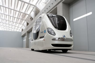 A Personal Rapid Transit (PRT) vehicle, or self-driving electric pod car, that transports students between parking lots and the institute is on display at the Masdar Institute of Science and Technology in Abu Dhabi, United Arab Emirates, on Wednesday, January 5.  2011. Masdar, Abu Dhabi's government-backed renewable energy company, is on track to develop a clean energy city on time and plans to maintain current spending levels, its CEO said.  Photographer: Duncan Chard/Bloomberg