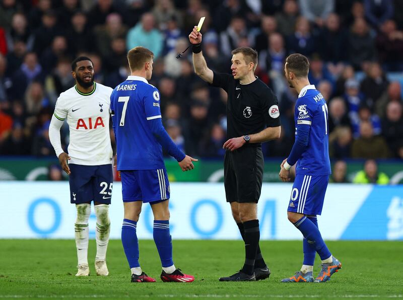 Leicester City's Harvey Barnes is shown a yellow card by referee Michael Salisbury. Reuters