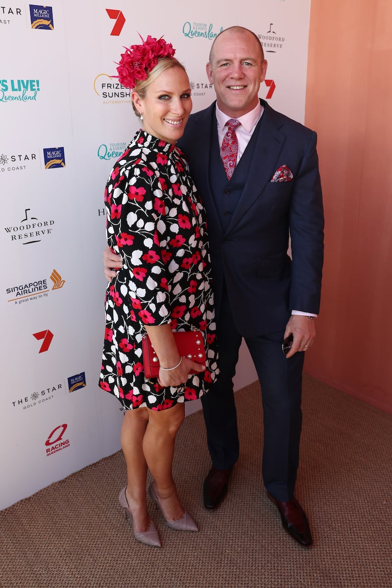 Zara Tindall, wearing a black, white and red poppy print dress and a clutch by Kate Spade, and Mike Tindall attend the Magic Millions Raceday at the Gold Coast Turf Club on January 12, 2019. Getty Images