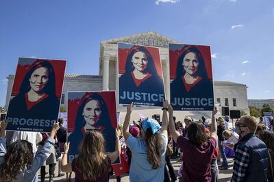 WASHINGTON, DC - OCTOBER 17: Supporters of Supreme Court nominee Judge Amy Coney Barrett show their support outside the Supreme Court on October 17, 2020 in Washington, DC. Demonstrators and supporters took to the streets in honor of the late Supreme Court Justice Ruth Bader Ginsburg and to protest President Donald Trump's nomination of Judge Amy Coney Barrett to the Supreme Court before the November election.   Tasos Katopodis/Getty Images/AFP
== FOR NEWSPAPERS, INTERNET, TELCOS & TELEVISION USE ONLY ==
