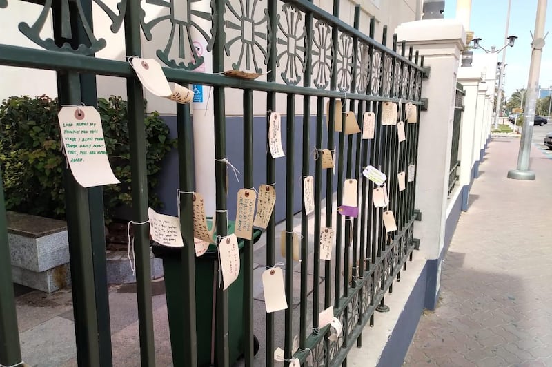 Messages left on the prayer wall at St Andrew's Church in Abu Dhabi. Places of worship are expected to remain closed until mid-April. Nick March / The National