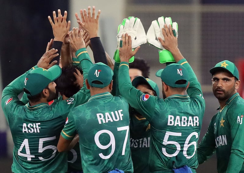 Pakistan celebrate the wicket of India's Suryakumar Yadav. Chris Whiteoak / The National