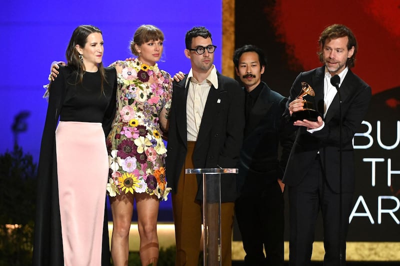 From left: Laura Sisk, Taylor Swift, Jack Antonoff, Jonathan Low and Aaron Dessner accept the Album of the Year award for ‘Folklore’ onstage during the 63rd annual Grammy Awards. AFP