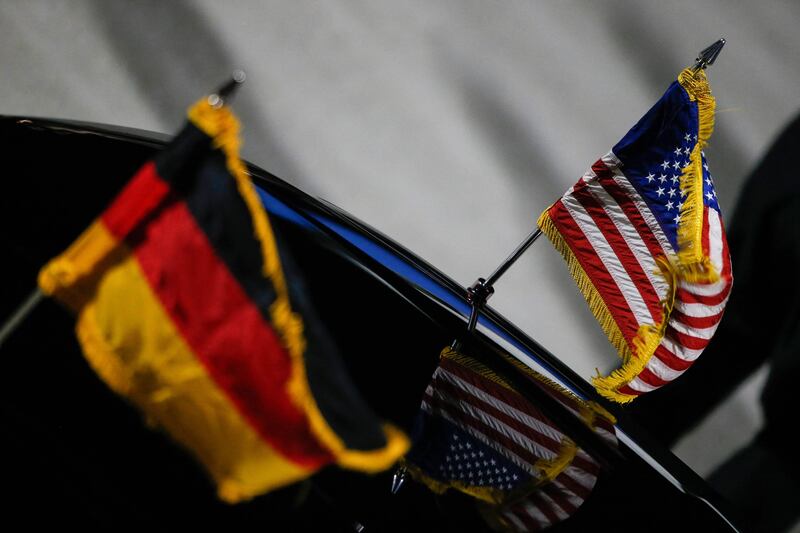 German and US flags on a car that will transport Ms Harris from the airport. AFP