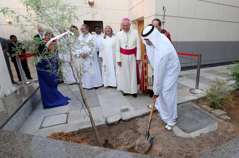 ABU DHABI , UNITED ARAB EMIRATES, October 03, 2018 :- Sheikh Nahyan bin Mubarak Al Nahyan, Minister of Tolerance ( right ) planting the ‘Ghaf’ sapling during the celebration as part of the 50th anniversary of the St Andrew’s Church in Abu Dhabi. ( Pawan Singh / The National )  For News. Story by John