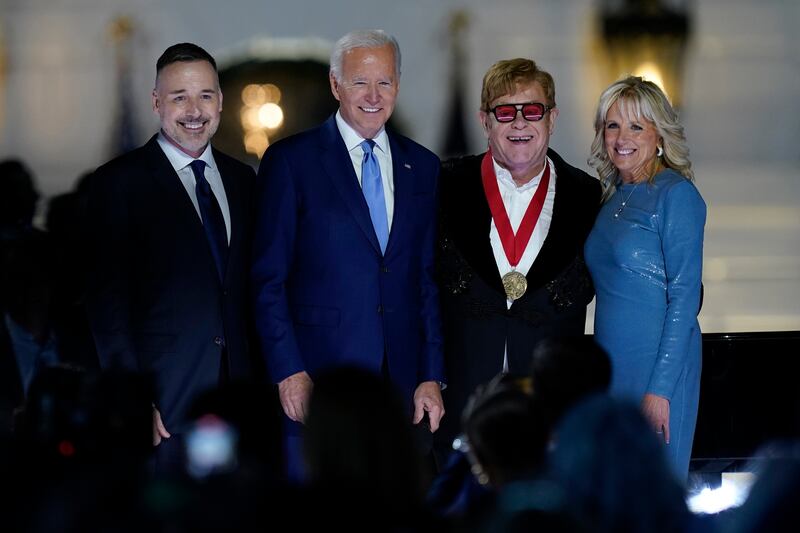 David Furnish, Sir Elton John, President Joe Biden and Jill Biden. AP