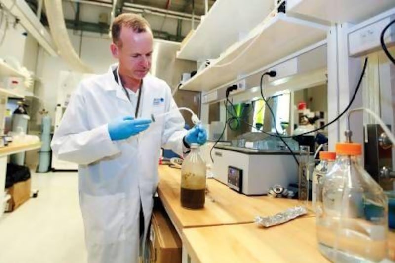 Dr. Jens Ejbye Schmidt, professor in Biofuels in the Chemical Engineering program at Masdar Institute, demonstrates how to convert organic waste into fuel in a campus laboratory in Abu Dhabi. Sarah Dea/The National