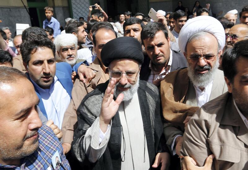 Iranian presidential candidate Ebrahim Raisi arrives to cast his ballot for the presidential elections at a polling station in southern Tehran on May 19, 2017. (Photo by ATTA KENARE / AFP) / ���The erroneous mention[s] appearing in the metadata of this photo by ATTA KENARE has been modified in AFP systems in the following manner: [arrives to cast his ballot] instead of [leaves after casting his ballot]. Please immediately remove the erroneous mention[s] from all your online services and delete it (them) from your servers. If you have been authorized by AFP to distribute it (them) to third parties, please ensure that the same actions are carried out by them. Failure to promptly comply with these instructions will entail liability on your part for any continued or post notification usage. Therefore we thank you very much for all your attention and prompt action. We are sorry for the inconvenience this notification may cause and remain at your disposal for any further information you may require.���