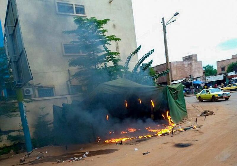 A roadside stall burns following looting after Mali military entered the streets of Bamako, Mali.  EPA