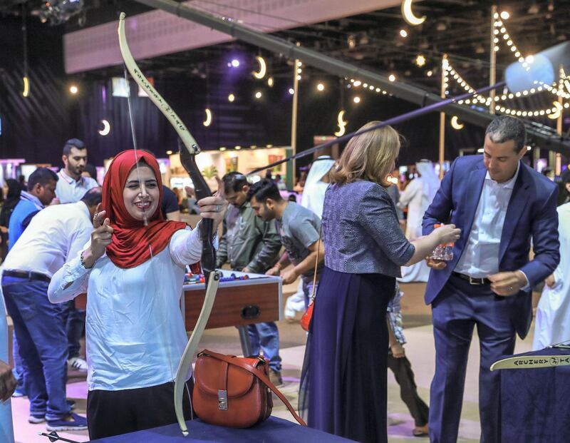 Abu Dhabi, U.A.E., May 30, 2018.  Ramadan Exhibition at ADNEC.  Visitors enjoy the nerf archery booth.
Victor Besa / The National
Reporter:  Saeed Saeed
Section:  Arts & Culture