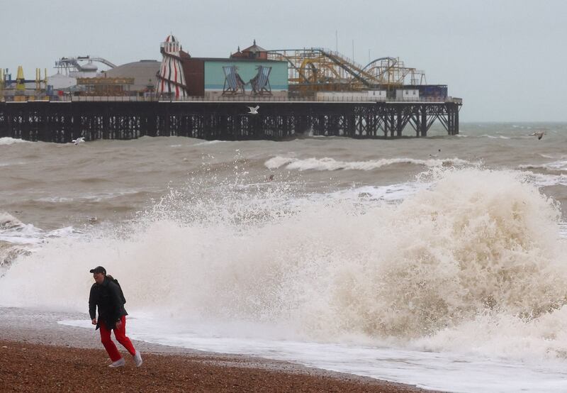 Large waves form in Brighton. The Met Office warned winds of up to 129kph could occur along exposed coastal stretches. Reuters