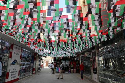 DUBAI , UNITED ARAB EMIRATES , November 28  – 2018 :- Market place in Bur Dubai decorated with UAE national flags for the National Day celebration in Dubai. ( Pawan Singh / The National ) For News. 